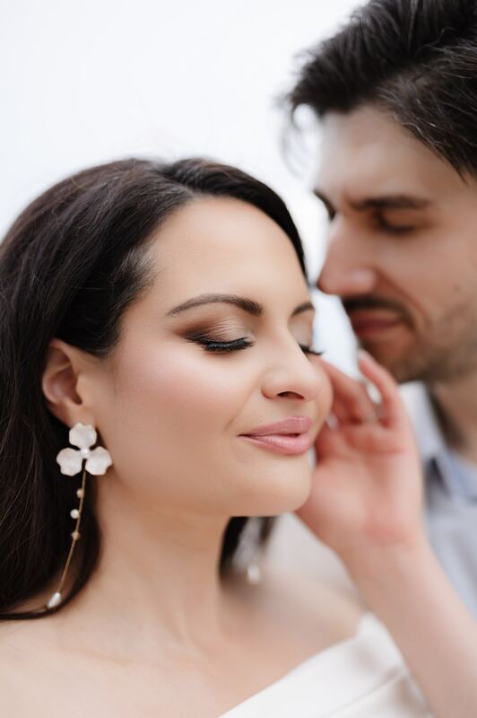 Iviani laughing as Joey nuzzles her cheek