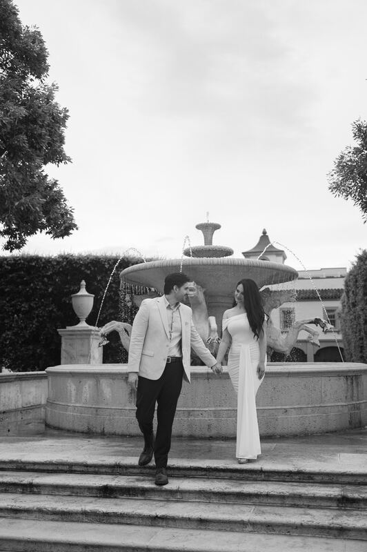 Black-and-white photo of Iviani and Joey at the fountain